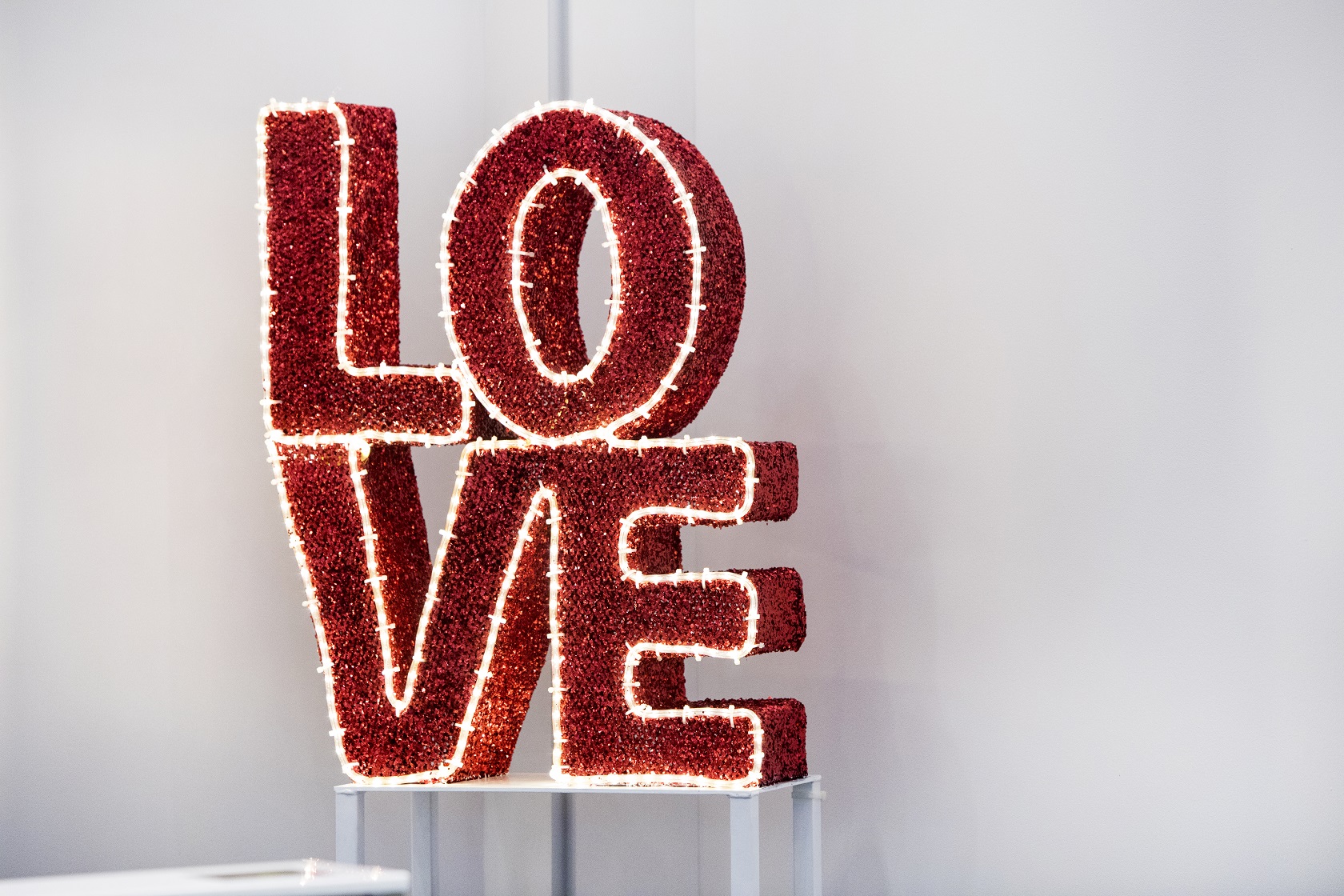 Creative sculptures and 3D letters come together to light up this contemporary lobby through the holiday season